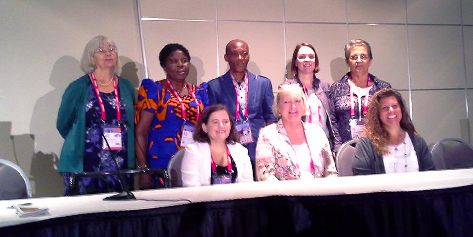 Top row (left to right): Lesley Farmer, Gertrude C. Umunnakwe, Emmanuel U. Anyanwu, Valérie Glass, Isabel Mendinhos. Seated (left to right): Clayton Copeland, Karen Gavigan, and Elizabeth Burns.