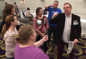 Brian Mayer, gaming and library technologies specialist with the Genesee Valley School Library System, leads an <em>Action Castle</em> session with participants.