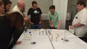 Attendees at the Gaming As Meaningful Education conference try out new tabletop games for the classroom.