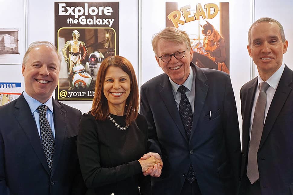 ALA and the German Library Association (BID) celebrated the start of a three-year partnership between US and German libraries at the German Library Congress in Leipzig March 14–17. From left: Kent Logsdon, deputy chief of mission, US Embassy in Germany; ALA Past President Sari Feldman; BID President Heinz-Jürgen Lorenzen; and Scott R. Riedmann, US consul general in Leipzig. Photo: Melanie Duong