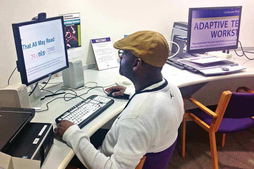 Ken Redd uses a screen magnification program on an adaptive computer workstation at the Ohio Library for the Blind and Physically Disabled.