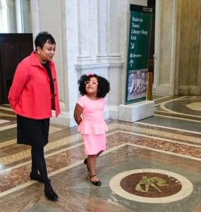 Daliyah Marie Arana shadows Librarian of Congress Carla Hayden. Photo by Shawn Miller.