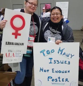 Marchers holding posters