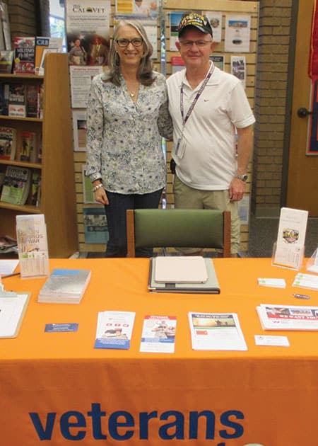 Evelyn Figeroid, library assistant and coordinator for the Rancho Cordova (Calif.)Library Veterans Connect, with veteran and volunteer Bill Mattingly at the Library Veterans Resource Station. (Photo: Teri DeVoe/Institute of Museum and Library Services)