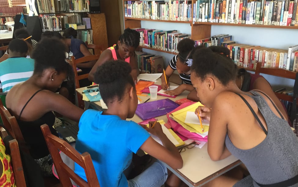 Students in the Soufrière (St. Lucia) Young Authors project work on their projects during the weeklong workshop.