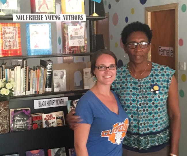 Peace Corps volunteer Grace Kilbane (left) and Soufriere Public Library Director Catherine Prospere in the library.