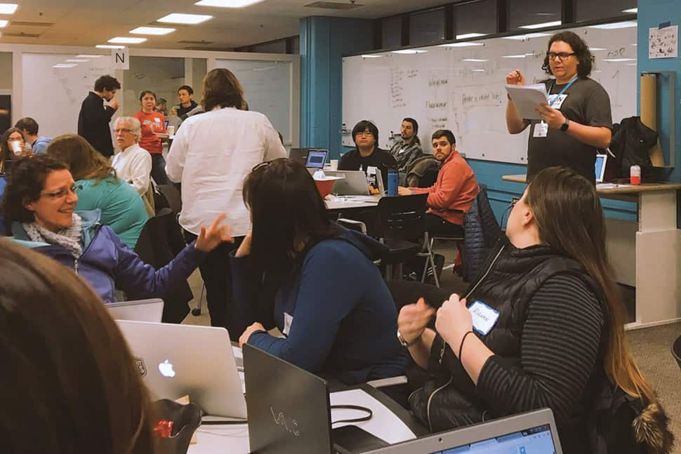 Justin Schell (standing, top right), director of Shapiro Design Lab at the University of Michigan’s Shapiro Undergraduate Library, was an organizer of a data rescue event at the library in January.