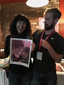 Amie Wright with author Chip Zdarsky and his look of horror upon meeting an actual librarian who has read his book, Sex Criminals.