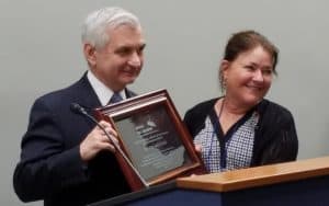 Sen. Jack Reed (D-R.I.) receives the United for Libraries Public Service Award from Executive Director Sally Reed.