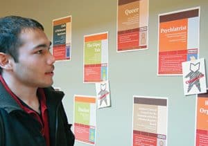 Williams College used a "wall catalog" to highlight its "books." Each book was represented by a poster that included a title, keywords, and suggested conversation starters. <span class="credit">Photo: Williams College Communications Office</span>