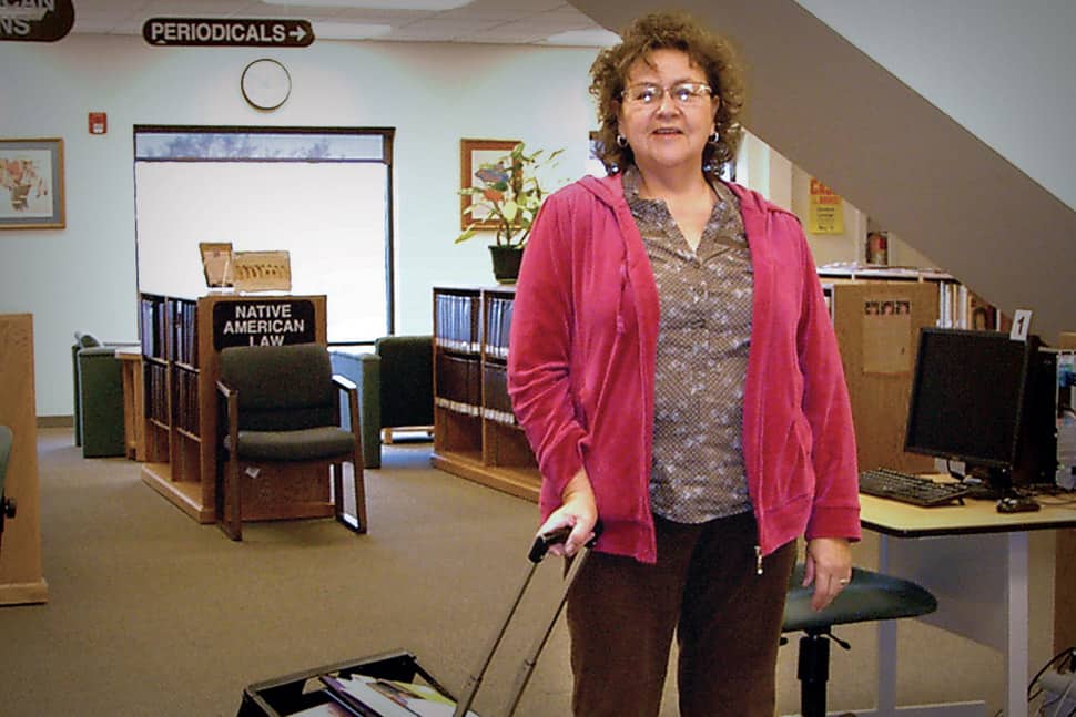 In her position as tribal aide to elders, Judi Bridge helps the senior citizens of Winnebago, Nebraska, make the most of the library.