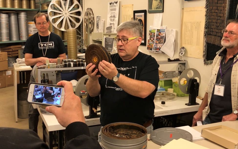 During the tour of the Library of Congress Culpeper facility, guests learn about nitrate film decomposition from Nitrate Film Vault Manager George Willeman (center). Photo: Steve Zalusky