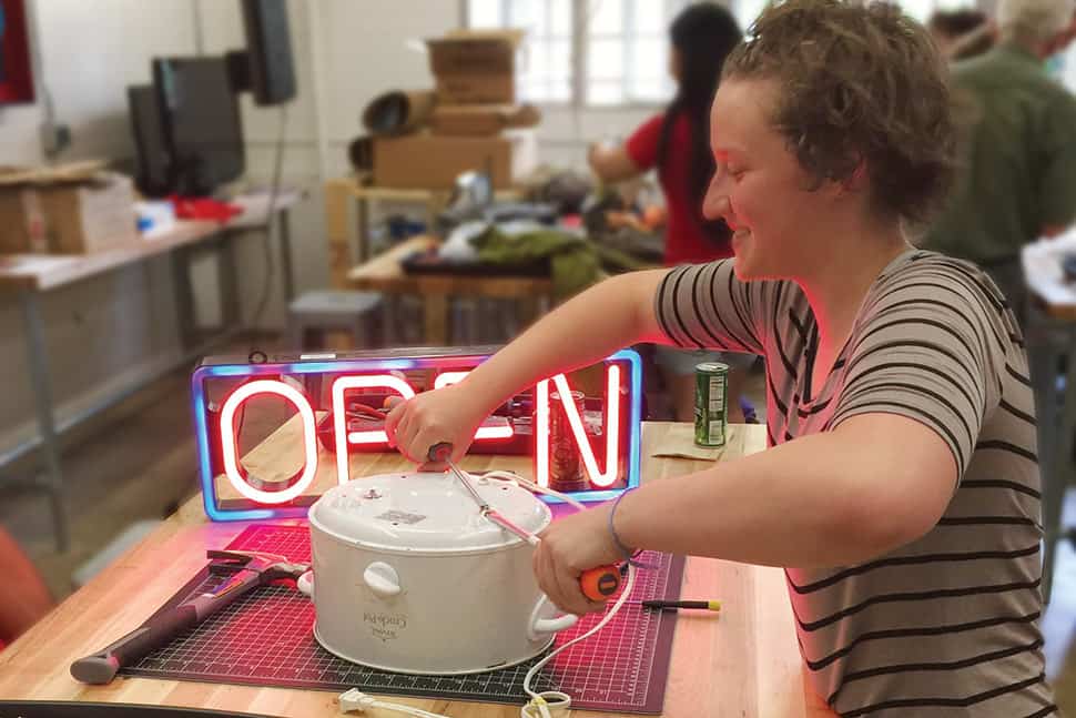 Patron Rebecca Bloom repairs a rice cooker at Boulder (Colo.) Public Library's U-Fix-It Clinic.