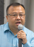 Touger Vang speaking at the Project Welcome Summit in February.