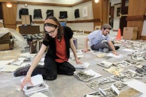 Rabbi Sarah Fort (left) helps salvage flood-damaged photo archives at Beth Yeshurun synagogue in the aftermath of Hurricane Harvey. Photo by Michael Duke/Jewish Herald-Voice