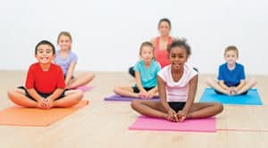 Group of children in yoga class.