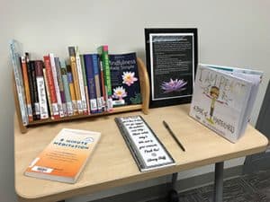 Library books housed in the Tulsa (Okla.) Community College meditation room, along with a comment book for patrons. Photo: Tulsa (Okla.) Community College.