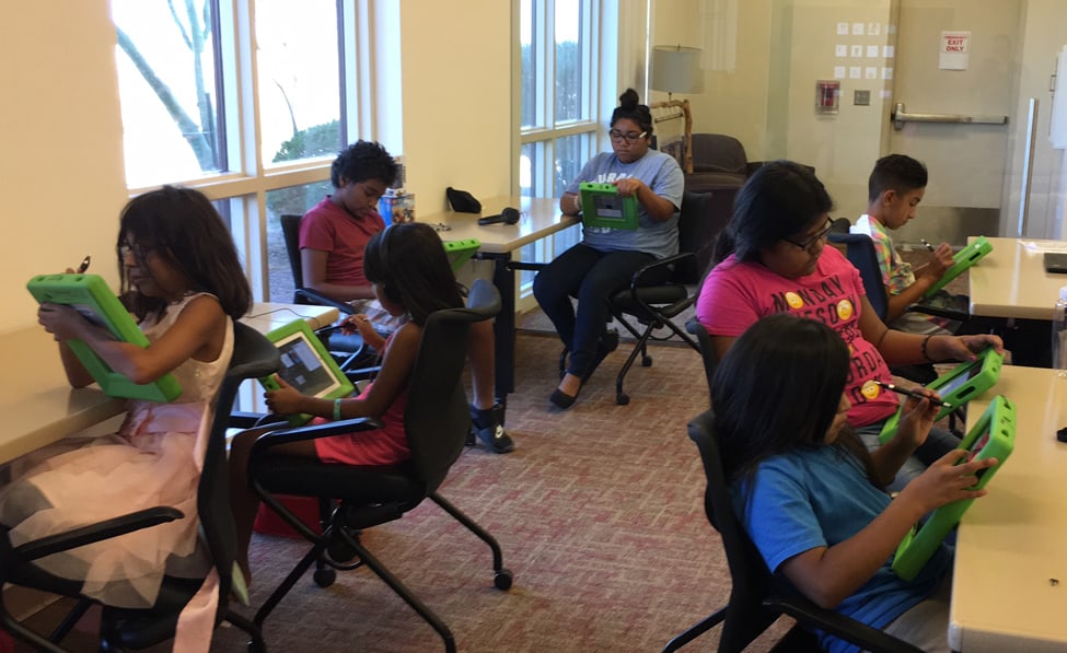 Young patrons at the Ak-Chin Indian Community Library in Maricopa, Arizona, use tablets to code by connecting to library Wi-Fi. (Photo: Jeffrey Stoffer/Ak-Chin Indian Community Library)