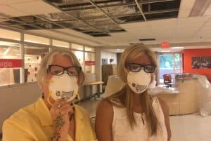 Reforma President Tess Tobin (left) and ALA President-Elect Loida Garcia-Febo visit a hurricane-damaged library at the University of Puerto Rico.