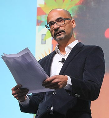 Junot Díaz in front of a projection of the cover of his new children's book, <i>Islandborn</i>, (Dial Books, 2018). <span class="credit">Photo: Cognotes</span>