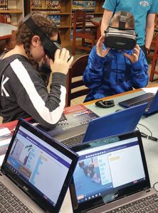 Students at Bay Shore (N.Y.) Middle School participating in a CoSpaces Hour of Code activity are able to drag and drop blocks to write their code and see it performed in VR. Photo: Kristina A. Holzweiss