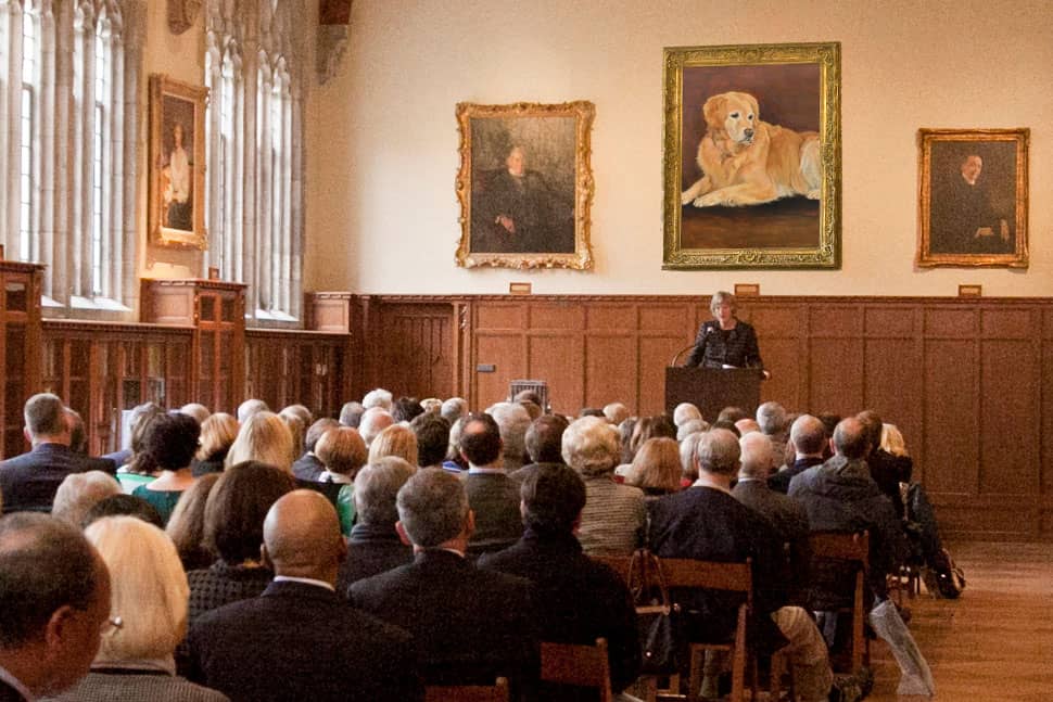 A portrait of Nugget, Duke University's famous golden retriever, is added to the reading room at Duke’s Rubenstein Library on Sunday, April 1.