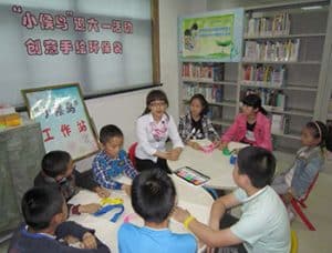 A librarian (center) with students at Suzhou Library.