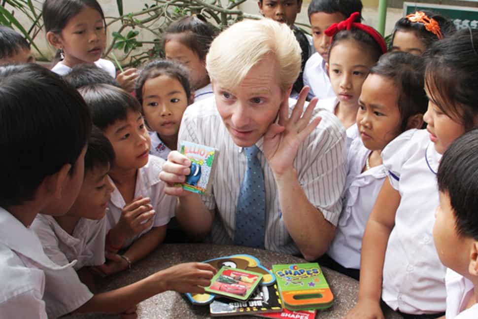 John Hickok (center) interacts with students at a school in Kandal Province, Cambodia.