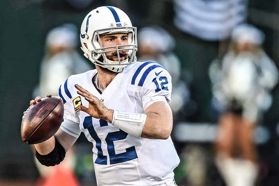 Colts quarterback Andrew Luck talks with media