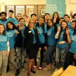 ALA President Loida Garcia-Febo (center) and students at Cranston (R.I.) High School East pose in the school's library.