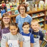 Liz Quakenbush and students at Orchard Park Elementary School in Indianapolis pose in the library.