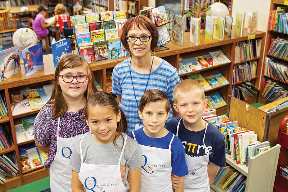 Liz Quakenbush and students at Orchard Park Elementary School in Indianapolis pose in the library.