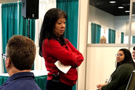 Melissa Lockaby, assistant professor of library science at the University of North Georgia, demonstrates how not to greet patrons in libraries.