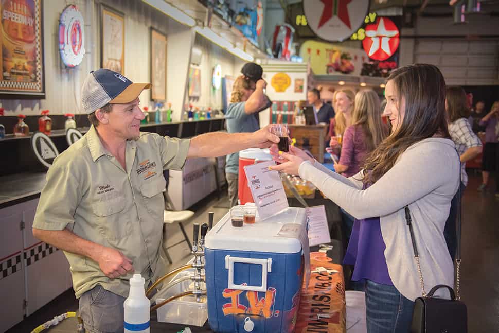 An attendee samples craft beer at a 2018 “Stouts and Stories, Ales and Tales” event hosted by Jefferson County (Colo.) Library Foundation.Photo: Steve Hostetler