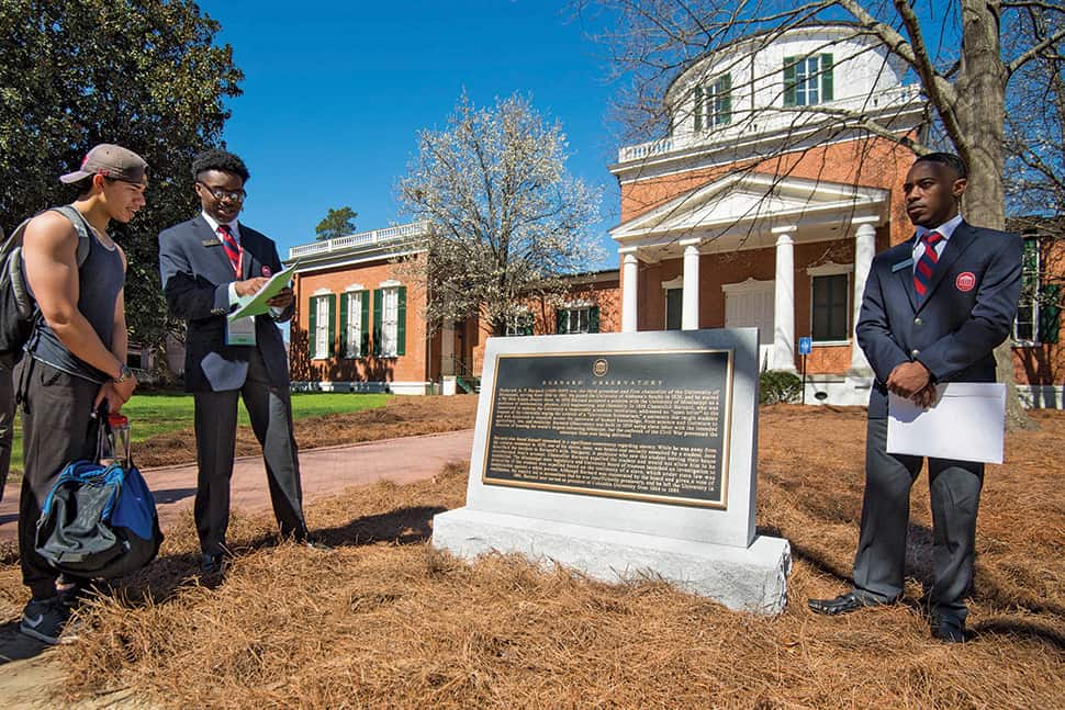 Columns Society members at University of Mississippi tell visitors about the Committee on History and Context plaque placed at Barnard Observatory.