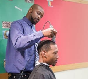 Kenneth Clayton cuts James Trautman’s hair during a Barbershop in the Library event on June 20, 2016. Photo: Rebecca Lomax/American Libraries