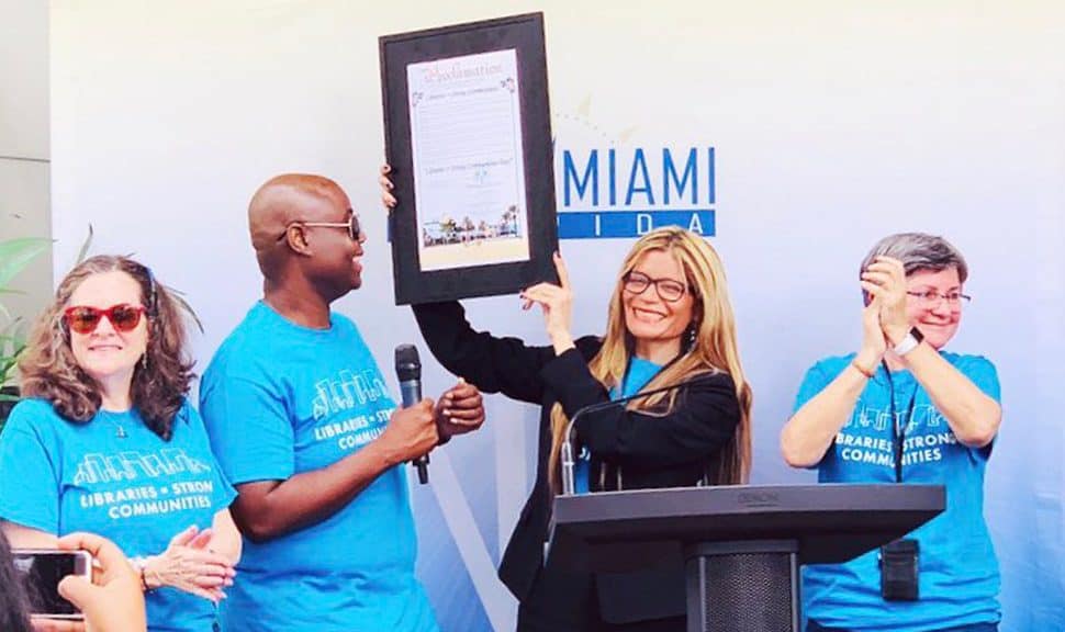 ALA President Loida Garcia-Febo holds a proclamation from the city of North Miami, Florida, during a Libraries = Strong Communities rally at North Miami Public Library February 9. From left: Councilwoman Carol Keys, Councilman Alix Desulme, Garcia-Febo, and Library Director Lucia Gonzalez.