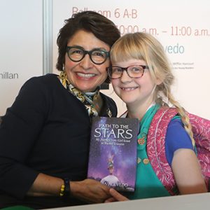 Sylvia Acevedo poses for a photo with Girl Scout Stephanie Trier after speaking at the 2019 ALA Midwinter Meeting. <span class="credit">Photo: Cognotes</span>