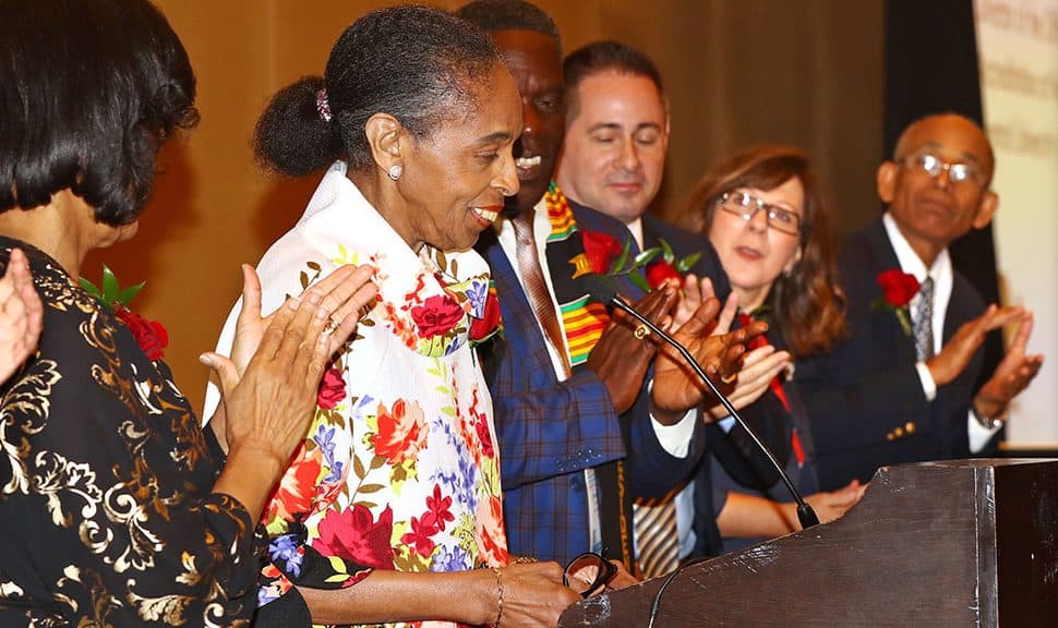 Pauletta Bracy (second from left) gets a standing ovation as she receives the Virginia Hamilton Award for Lifetime Achievement during the Coretta Scott King Book Awards 50th Anniversary Breakfast.