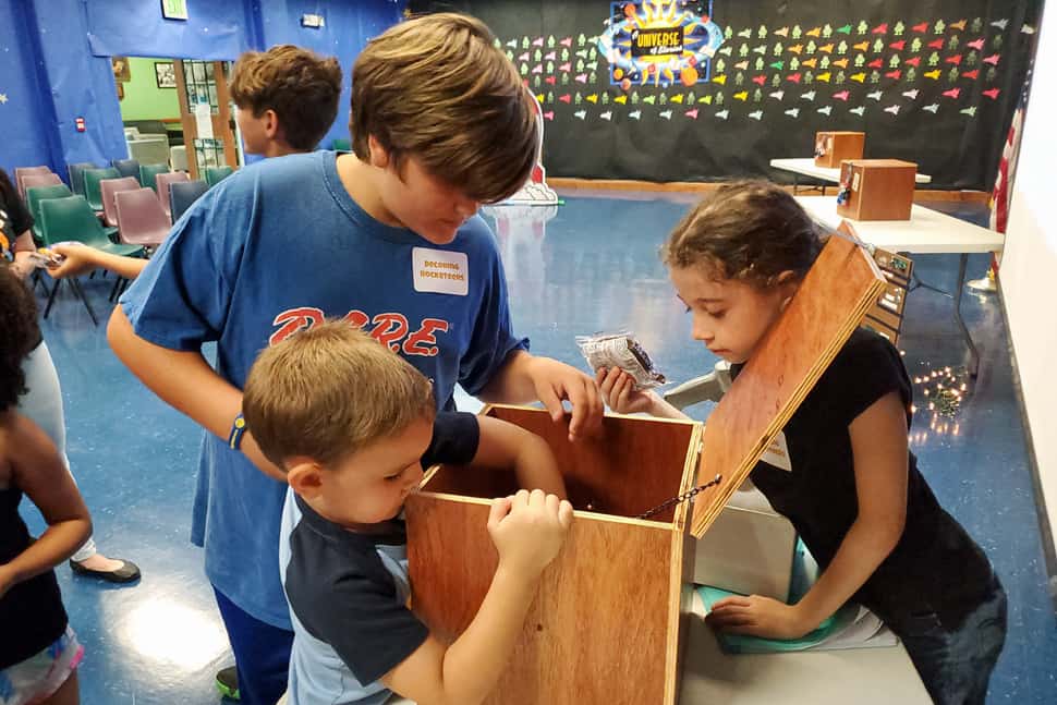 Players unveil a clue at one of Lafourche Parish (La.) Public Library's Escape to Outer Space events. Photo: Skylar Shira