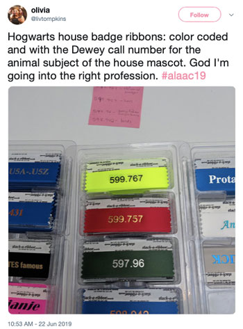 Hogwarts house badge ribbons: color coded and with the Dewey call number for the animal subject of the house mascot. God I'm going into the right profession.