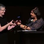 Incoming IFLA President Christine Mackenzie (left) accepts the gavel from outgoing President Glòria Pérez-Salmerón during the Closing Session in Athens, Greece, August 29.