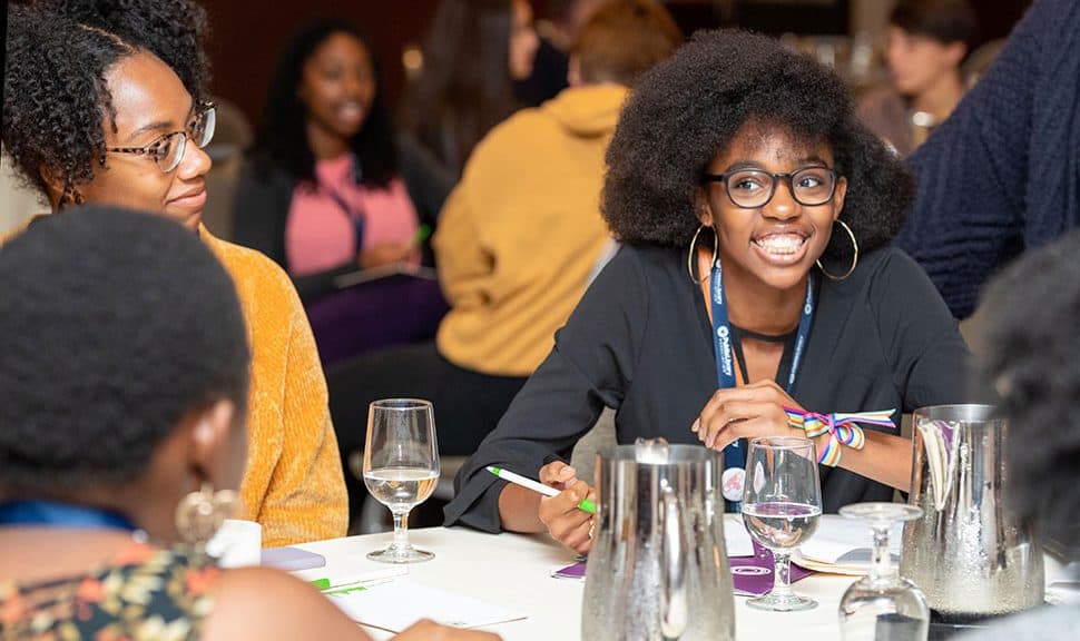 Sade Wilkins El (right), an intern with Public Library Association's Inclusive Internship Initiative (III), networks at the III wrap-up event in Washington, D.C.