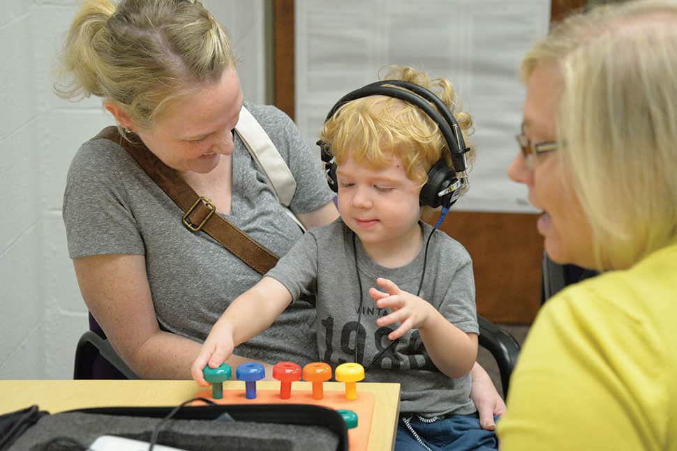 A child undergoes a hearing test at a Sense-Screening Storytime at Omaha (Neb.) Public Library’s Swanson branch. Photo: Omaha (Neb.) Public Library