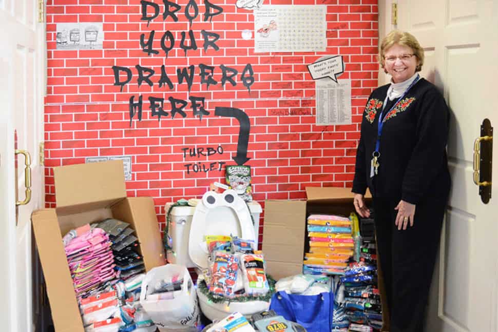 Conte Flowers, Family Resource Center coordinator for Gallatin County (Ky.) Elementary Schools (one of the statewide participants), poses at a collection point. (Photo: Kelley Warnick/Gallatin County (Ky.) News)