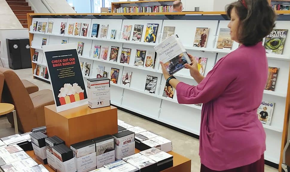 Leah Elzner, a staff member at Mandel Public Library in West Palm Beach, Florida, looks over the latest binge bundles. (Photo: Mandel Public Library in West Palm Beach, Florida)