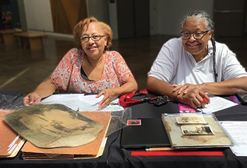 Visitors to the California African American Museum used Los Angeles Public Library’s Mobile Memory Lab to digitize family photos and documents at an August 2019 event at the museum. Photo: Los Angeles Public Library.