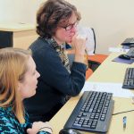 Law Librarians of New England members Ashley Selima (left) and Stephanie Edwards work with Rhode Island’s early suffrage documents at a 2018 transcription party. Photo: Joe Graziano/Rhode Island Department of State
