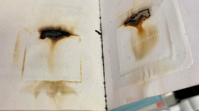 Image of burned RFID tag inside a microwaved book from Kent District Library in Comstock Park, Michigan.