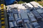 A police photograph of packages of rare books worth £2.5 million found in a cement pit in Neamț, Romania; 13 people have been charged. (Photo: Met Police)
